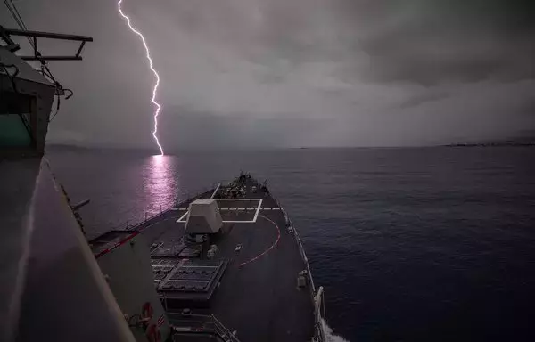 Lightning strikes the water as the USS Roosevelt transits the Strait of Messina on November 20. [US Navy]