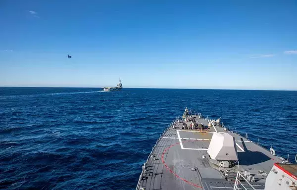 The USS Roosevelt accompanies the French aircraft carrier Charles de Gaulle on November 21. [US Navy]