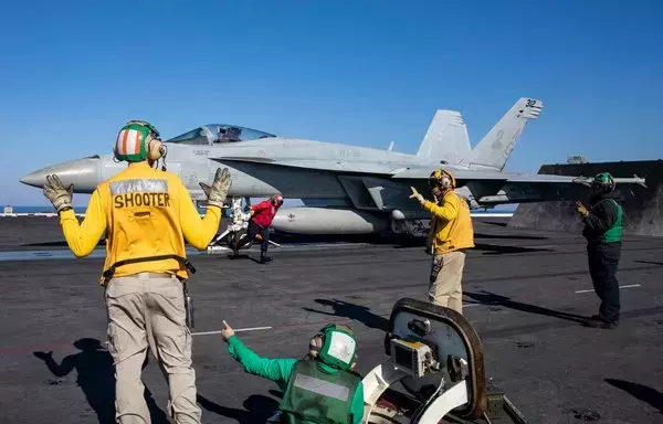 An F/A-18E Super Hornet on the deck of the aircraft carrier USS George H.W. Bush on October19. [US Navy]