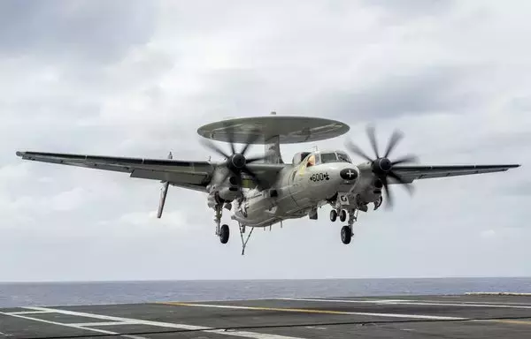 An E-2C Hawkeye approaches for an arrested landing aboard the aircraft carrier USS Nimitz on December 26 in the Philippine Sea. [US Navy]