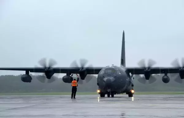 Airmen and equipment arrive aboard an HC-130J Combat King II aircraft. [US Air Force]