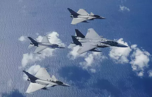Singaporean F-15s and F-16s fly along with French Rafale fighter jets above the South China Sea on January 20. [Singapore Air Force]