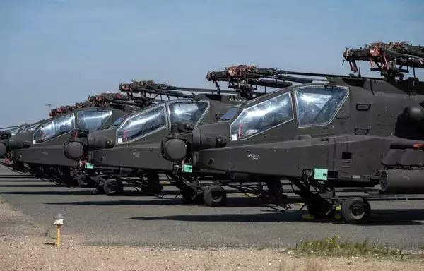US Army AH-64 Apaches sit on the flight line at Ali Al Salem Air Base in Kuwait on February 10. [US Air Force]