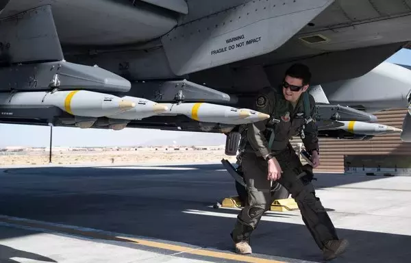 An A-10 pilot inspects 16 Small Diameter Bombs (SDBs) prior to flight at Nellis Air Force Base in Nevada, April 20. [US Air Force]