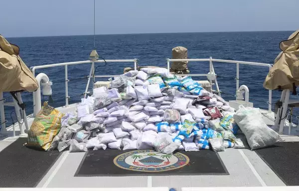 US Coast Guard fast response cutter Glen Harris, operating as part of Combined Task Force 150, seized bags of illegal drugs, seen here piled on the deck of a fishing vessel, from Iran in the Gulf of Oman on May 10. [US Navy]