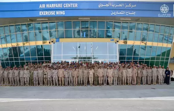 Participating forces in Eagle Resolve 23 from Saudi Arabia, the United States and other Gulf countries pose for a group picture on 22 May 2023 at the Air Warfare Centre at King Abdulaziz Air Base in Saudi Arabia. [Saudi Ministry of Defence]