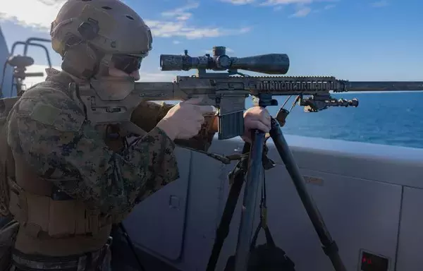 A US Marine sights in on an M110 semi-automatic sniper system during a training exercise on the USS New Orleans in the Coral Sea July 8. His unit, the 31st Marine Expeditionary Unit, is part of the III Marine Expeditionary Force. [US Marine Corps/Sgt. Marcos A. Alvarado]