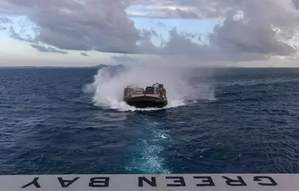 A landing craft air cushion (LCAC) enters the well deck of the amphibious transport dock ship USS Green Bay (LPD 20) during amphibious operations for a combined joint live-fire exercise, as part of Exercise Talisman Sabre, July 23. [US Navy]