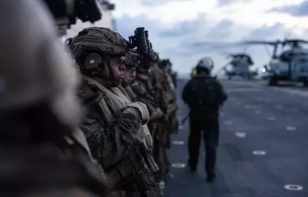 US Marines with the 26th Marine Expeditionary Unit prepare to conduct a tactical recovery of aircraft and personnel (TRAP) as part of a composite training unit exercise (C2X) aboard the Wasp-class amphibious assault ship USS Bataan (LHD 5) in the Atlantic Ocean May 21. [US Marine Corps]