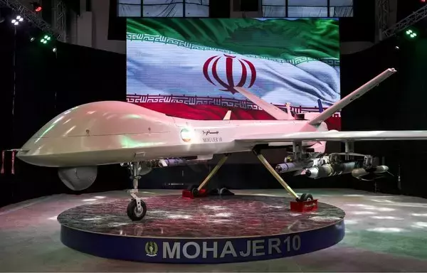 Iran's latest domestically built drone, Mohajer-10, is displayed during Iran's defense industry achievement exhibition, on August 23 in Tehran. [Atta Kenare/AFP]