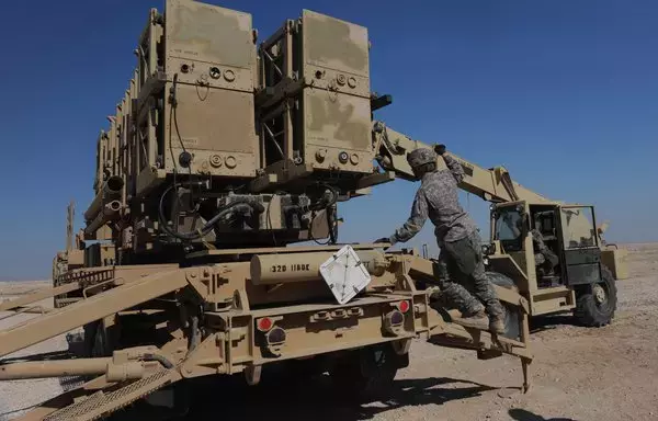 US Army troops reload a Patriot launch station with missiles during a missile reload certification event at an undisclosed Southwest Asian location on February 8, 2010. [US Army]