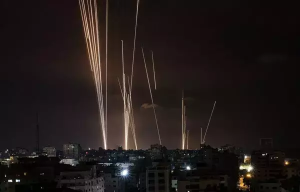 A salvo of rockets is fired by Palestinian militant group Hamas from Gaza toward Israel on October 7. [Mahmud Hams/AFP]