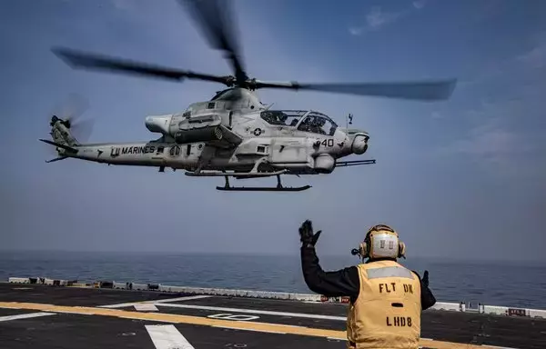 An AH-1Z Venom helicopter takes off from the amphibious assault ship USS Makin Island on March 29. [US Marine Corps]