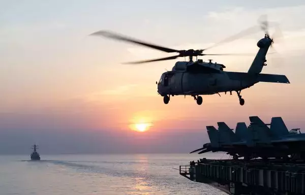 An MH-60R Seahawk takes off from the flight deck of an aircraft carrier. [CENTCOM]