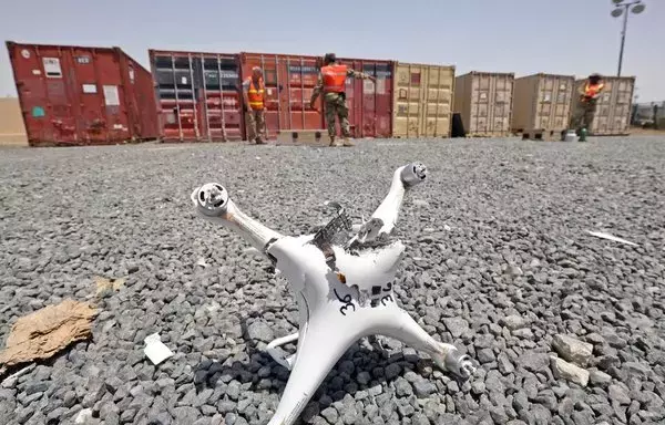 A damaged drone is pictured during a military drill at the US Camp Arifjan in Kuwait City, on May 4. [Yasser al-Zayyat/AFP]