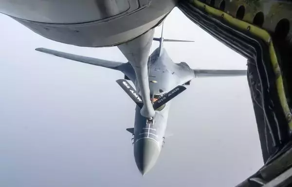 A US Air Force B-1 Lancer begins aerial refueling from a KC-135 Stratotanker assigned to the 912th Expeditionary Air Refueling Squadron while conducting a Bomber Task Force mission over the US Central Command area of responsibility June 8. [US Air Force]