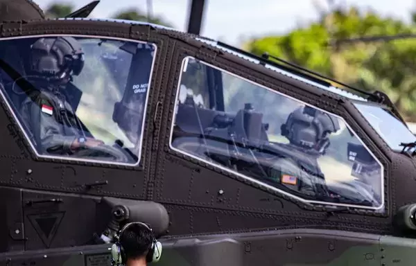 An Indonesian army AH-64 Apache helicopter prepares to take off for a joint training flight with a Indonesian pilot and an American gunner during Exercise Super Garuda Shield at Camp 515 Indonesian National Armed Forces Infantry Base, Banyuwangi, Indonesia, August 30. [US Army]