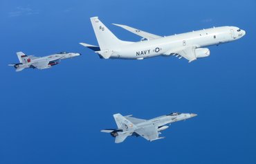 US Navy support aircraft track threats across the skies, land and sea