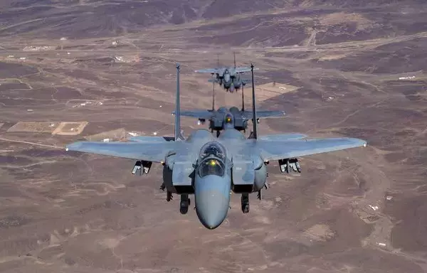 US and Saudi F-15E Strike Eagles fly in formation over the US CENTCOM AOR September 5, 2022, during Agile Spartan, a joint training exercise that enhances international partnership and regional security. [US Air Force/Staff Sgt. Christian Sullivan]