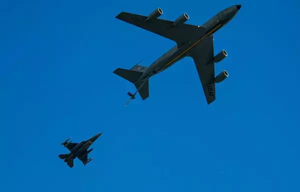 A KC-135 Stratotanker performs a no-contact aerial refueling demonstration with an F-16 Fighting Falcon during an airshow last March 29 in Lakeland, Florida. The KC-135 provided a non-contact. [US Air Force]