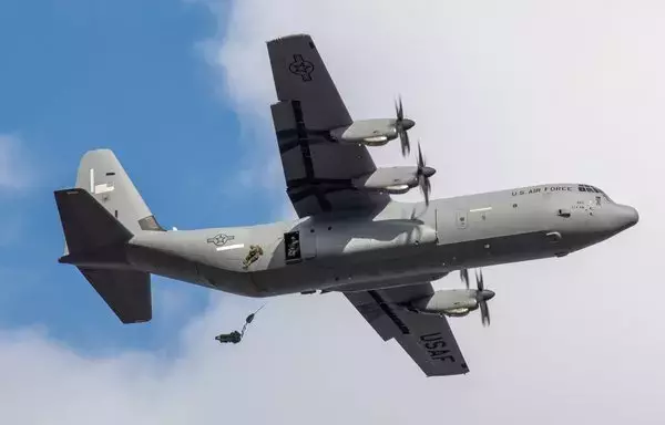 Japan Ground Self-Defense Force paratroopers jump out of a US Air Force C-130J Super Hercules during the annual New Year's Jump in Chiba, Japan, January 7. Approximately 40 JGSDF paratroopers jumped out of several C-130 aircraft during the event. [US Air Force]