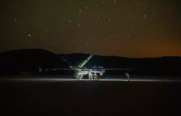 An MQ-9 Reaper conducts the first MQ-9 landing on a dirt landing zone during a training exercise June 15. The nighttime landing on an unimproved surface was part of a larger Air Force Special Operations Command exercise involving members of the 26th Special Tactics Squadron. [US Air Force]