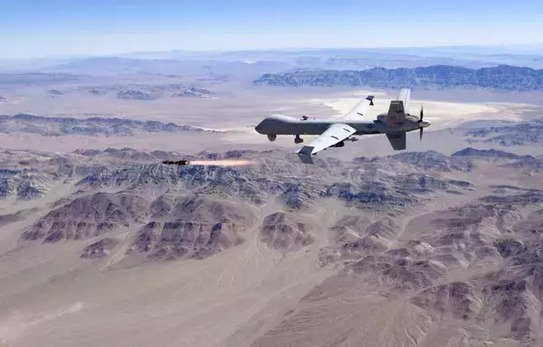 An MQ-9 Reaper, piloted by the 556th Test and Evaluation Squadron (TES), fires a Hellfire missile last August 30. The 556th TES performs all software and physical testing to improve the combat capabilities of the MQ-9 Reaper. [US Air Force]