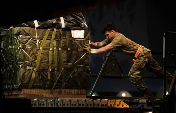 US soldiers prepare bundles of humanitarian assistance to air drop over Gaza on March 17. [CENTCOM]