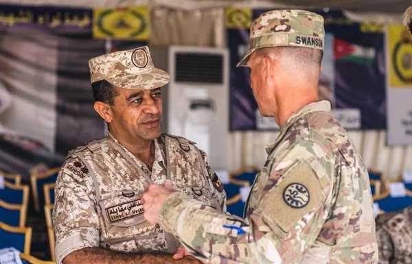 US Army Lt. Col. Cory Swanson gives his thanks to Jordanian Brig. Gen. Ahmed Al Maqableh after the final exercise of Exercise Eager Lion in Jordan September 14, 2022. [US Army]