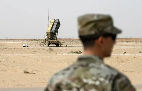 A member of the US Air Force looks on near a Patriot missile battery at the Prince Sultan air base in Al-Kharj, Saudi Arabia, on February 20, 2020. [Andrew Caballero-Reynolds/AFP]
