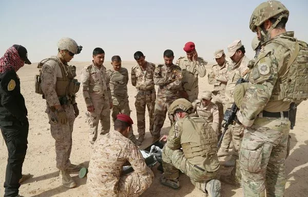 Coalition soldiers deliver training to an Iraqi Army explosive ordnance disposal team in April. [Operation Inherent Resolve]