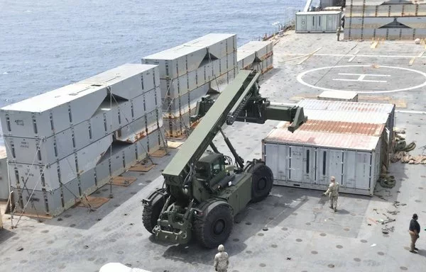 Construction of the floating JLOTS pier in the Mediterranean is under way. [CENTCOM]