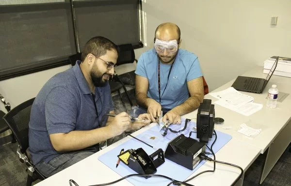 Royal Saudi officers learn about circuit board technology during the Electronic Warfare course circa 2023 at Joint Base San Antonio, Texas. [US Air Force]