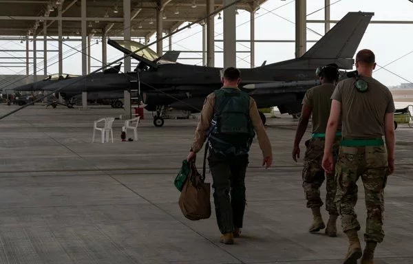 A US Air Force F-16 Fighting Falcon pilot heads towards a jet at King Faisal Air Base in Tabuk, Saudi Arabia, August 15, 2023, during Operation Agile Spartan 23.2. [US Air Force]