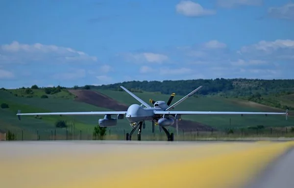 A remotely piloted US Air Force MQ-9 Reaper lands in Romania after completing a sortie May 13. [US Air Force]