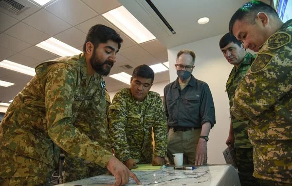 Personnel from the United States, Kazakhstan, Kyrgyzstan, Mongolia, Pakistan, Tajikistan and Uzbekistan work together August 16 during Exercise Regional Cooperation 23 in Helena, Montana. The Montana National Guard hosted the annual, multinational exercise. [US National Guard]