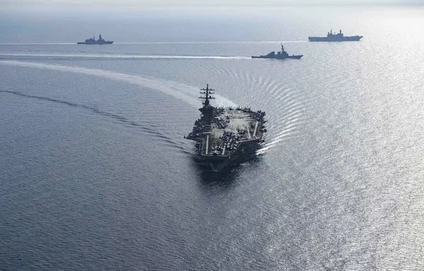 Nimitz-class aircraft carrier USS Dwight D. Eisenhower and Arleigh Burke-class guided-missile destroyers USS Laboon and USS Gravely steam in formation with the Italian aircraft carrier ITS Cavour, the Carlo Bergamini-class frigate ITS Alpino and the Horizon-class frigate FS Forbin in the Red Sea, June 7. [US Navy]