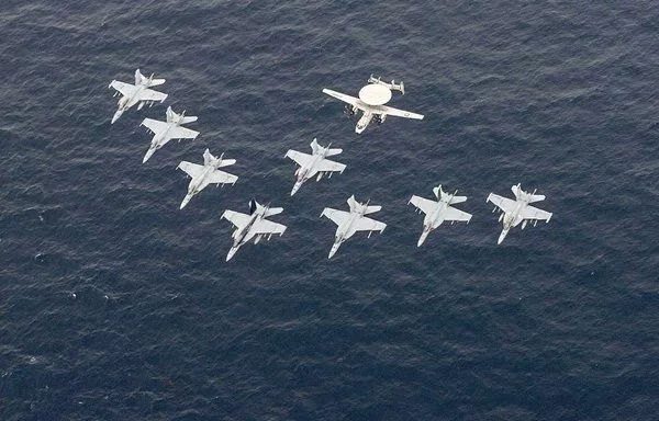 Aircraft assigned to Carrier Air Wing 11 (CVW-11) fly in formation during a trilateral exercise with ships assigned to the Theodore Roosevelt Carrier Strike Group, Japan Maritime Self-Defense Force and Republic of Korea Navy, April 11. [US Navy]