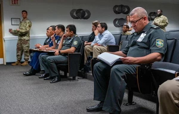 Senior Uzbek military officers listen and take notes during an overview of courses at Keesler Air Force Base in Mississippi, June 20, 2023. [US Air Force]