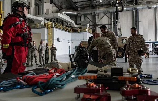 West Virginia Army National Guard Staff Sgt. Adam Landers briefs members of the Qatar Defense Attaché on the swift water rescue program at McLaughlin Air National Guard Base, Charleston, West Virginia, May 14, 2018. [US Air National Guard]