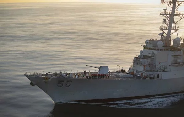 The Arleigh Burke-class guided-missile destroyer USS John S. McCain prepares to come alongside for a fueling at sea with the Nimitz-class aircraft carrier USS Theodore Roosevelt last November 28. [US Navy]