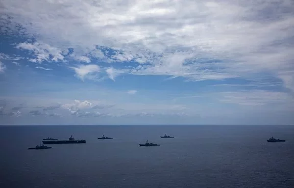 (L to R): The French Aquitaine-class frigate FS Bretagne, the Nimitz-class aircraft carrier USS Theodore Roosevelt, the Canadian Halifax-class frigate HMCS Montreal, the Arleigh Burke-class guided-missile destroyers USS Daniel Inouye, USS Halsey, USS Russell, and the dock landing ship USS Harpers Ferry transit the South China Sea in support of Valiant Shield 2024 on June 7. [US Navy]