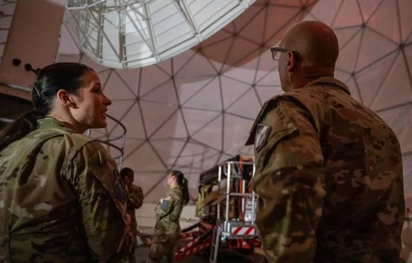 US Space Force personnel discuss a mission during a visit at RAF Feltwell in England, July 19. [US Air Force]