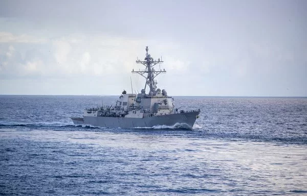 The Arleigh Burke-class guided-missile destroyer USS Spruance sails with the Nimitz-class aircraft carrier USS Abraham Lincoln, not pictured, during a simulated strait transit in the Pacific Ocean. [US Navy]