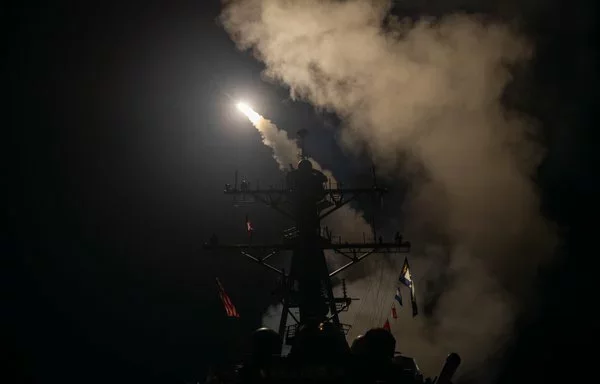 The guided-missile destroyer USS Gravely launches Tomahawk missiles in response to Iran-backed Houthi threats in the Red Sea on January 12. [US Navy]