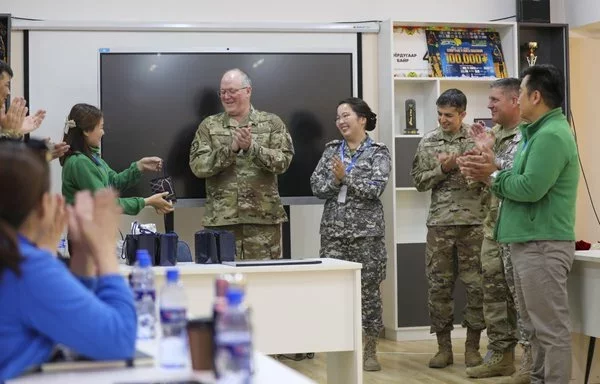 Exercise Gobi Wolf 24 participants congratulate each other after showcasing medical triage skills as part of the exercise's medical segment in Choibalsan, Mongolia, May 10. [US Army]