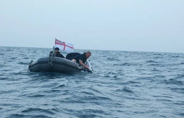 UK Royal Navy personnel deploy a REMUS 300 UUV in the Arabian Gulf. [UK Royal Navy]