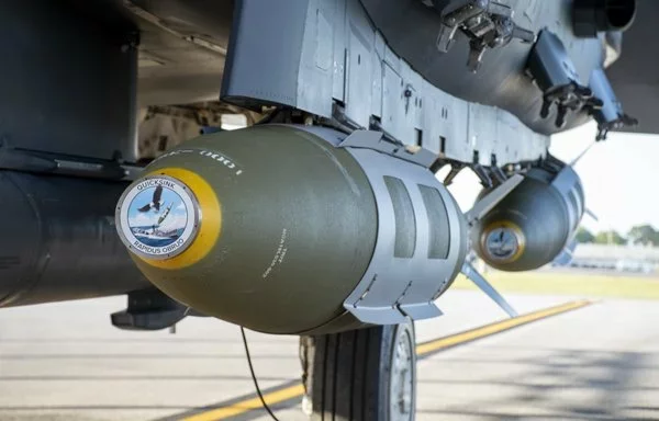 An F-15E Strike Eagle is shown with a modified GBU-31 Joint Direct Attack Munition as part of the second test of the QUICKSTRIKE Joint Capability Technology Demonstration on April 28, 2022. [US Air Force]