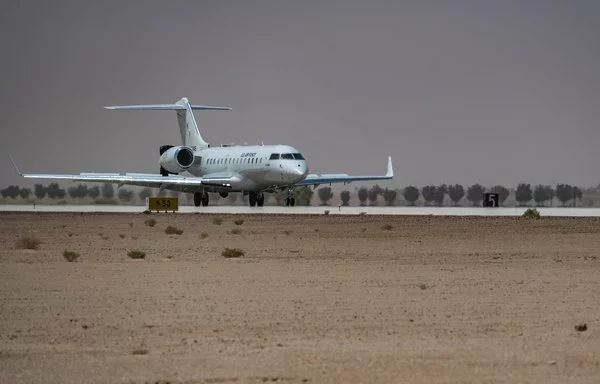 A US Air Force E-11A equipped with the BACN system lands at an undisclosed location within the US Central Command area of responsibility May 9. The E-11 enables all air assets involved in any airdrop mission to deliver aid precisely and on time. [US Air Force]