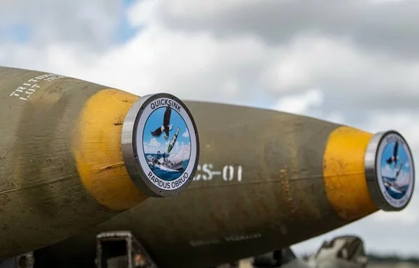 Two GBU-31 Joint Direct Attack Munitions are laid out in preparation to load onto an F-15E Strike Eagle at Royal Air Force Lakenheath, England, September 7, 2022. [US Air Force]